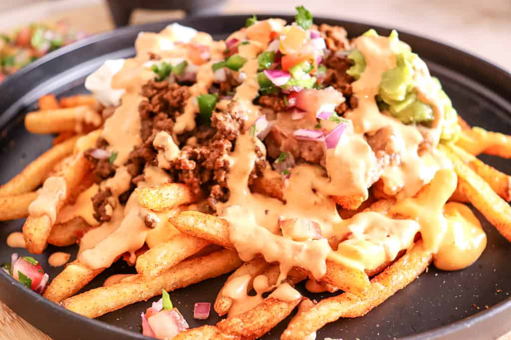 close up view of plated nacho fries