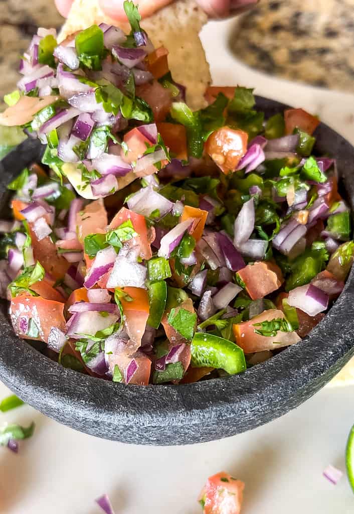 close up view of a bowl of pico de gallo