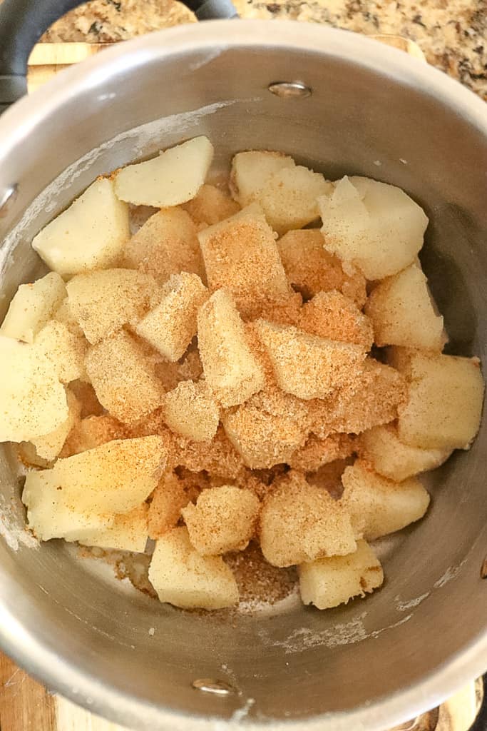 seasoned and chopped potatoes in a pan