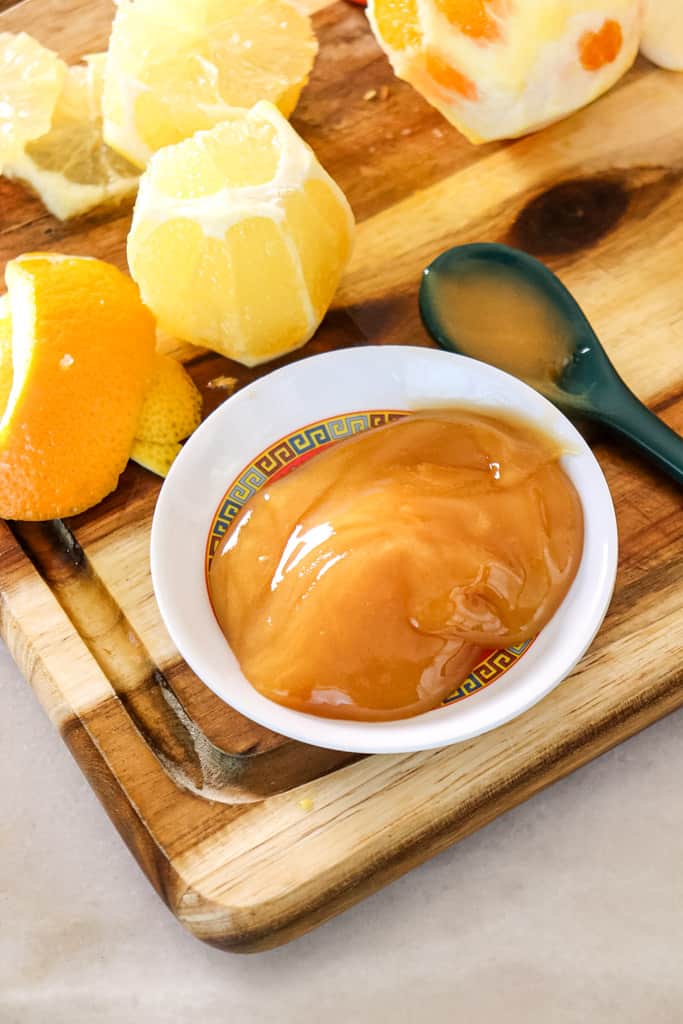 manuka honey in a bowl on a cutting board