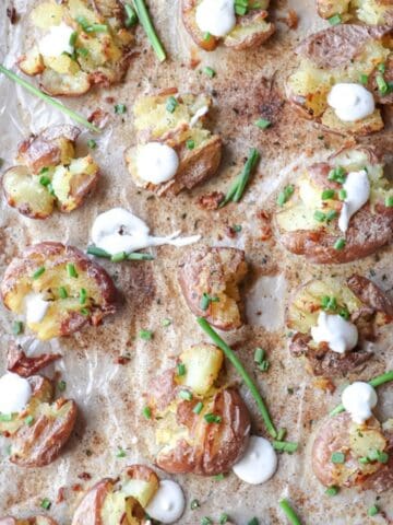 baked smashed potatoes on a baking sheet