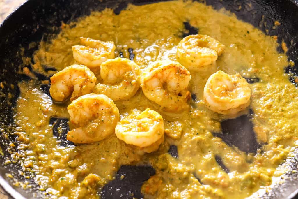 sauteed shrimp with sofrito cream sauce in a pan