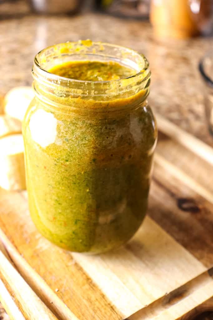 open jar of green sauce