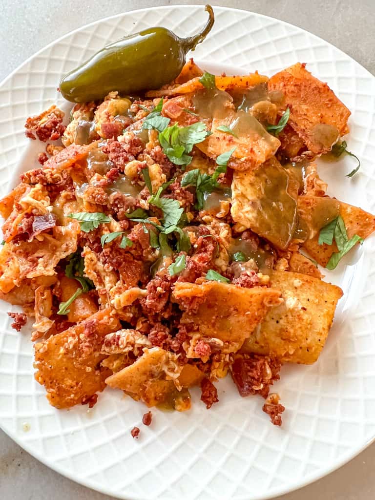 plated migas with chorizo with a side of jalapeno