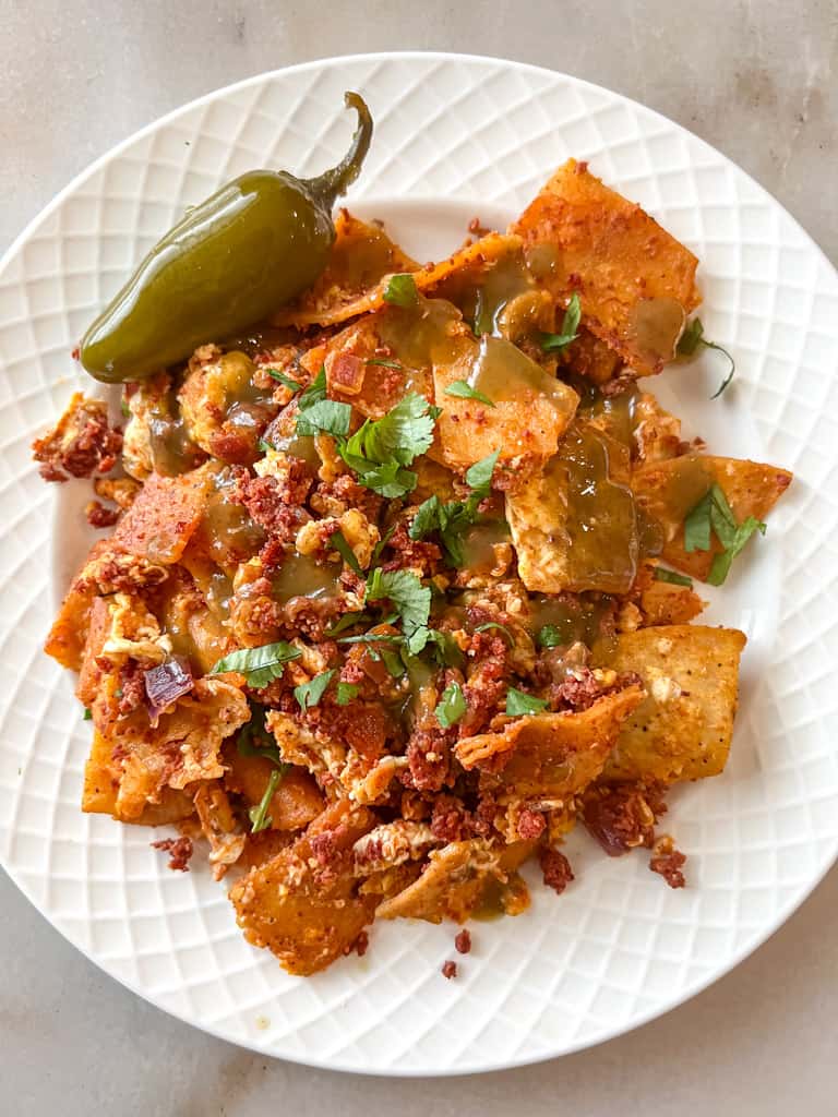 plated migas with chorizo with a side of jalapeno