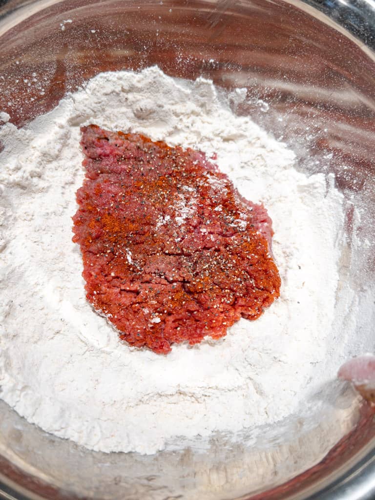 seasoned meat in flour