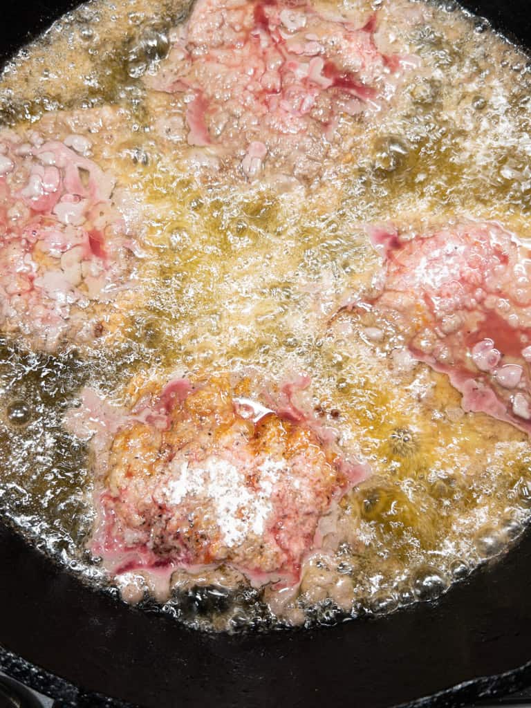 cube steaks frying in oil