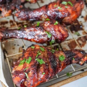 baked chicken legs on a rack