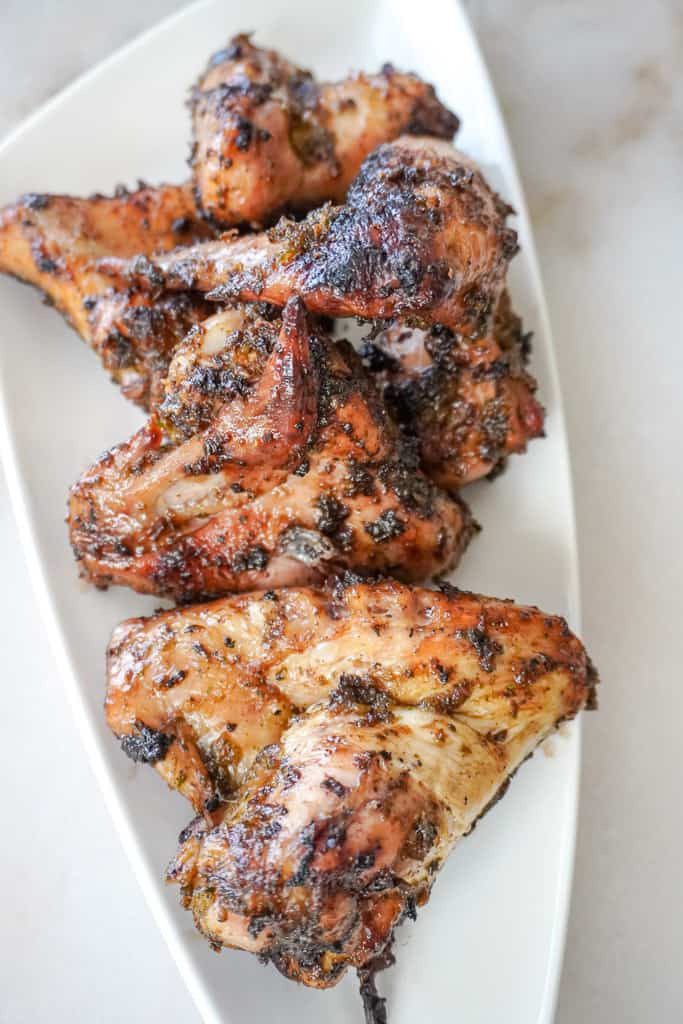 grilled chicken wings on a white plate