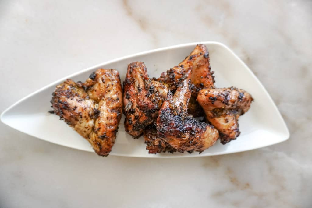 grilled chicken wings on a white plate
