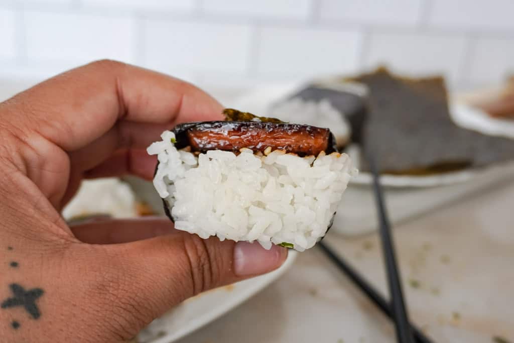 hand holding a spam musubi