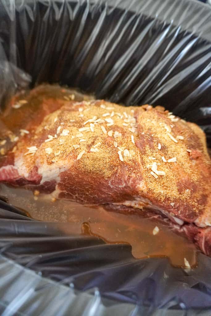 dry rubbed pork shoulder in a slow cooker