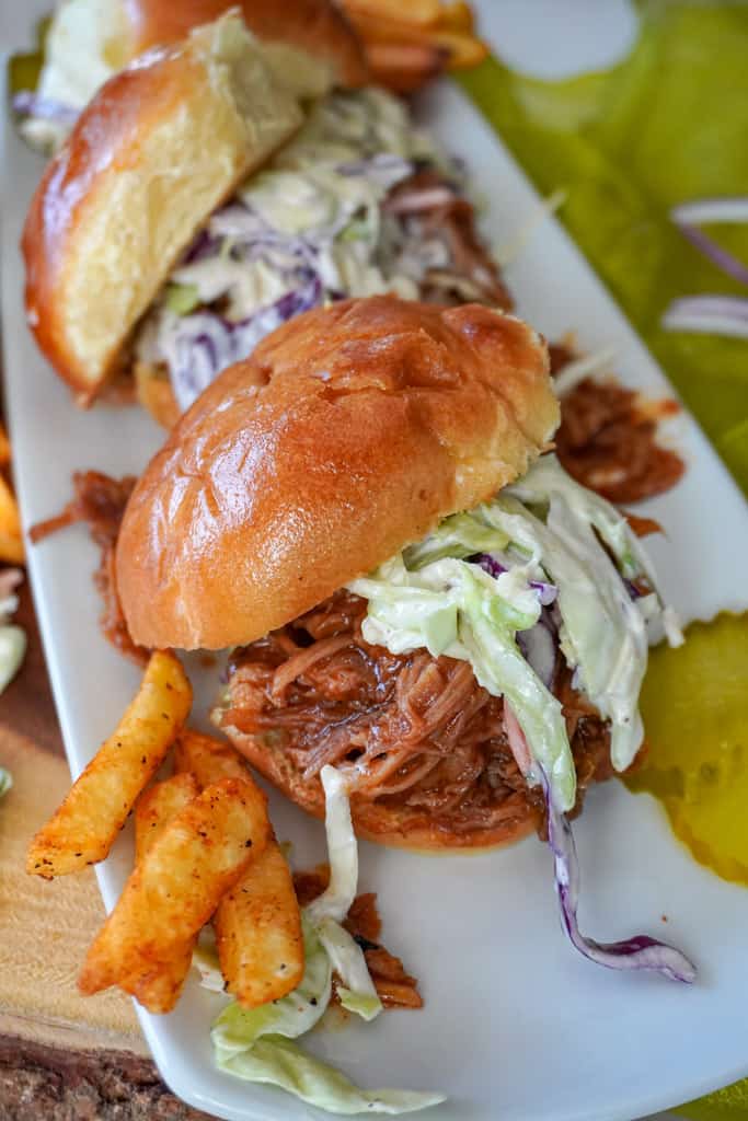 close up view of a plated pulled pork slider