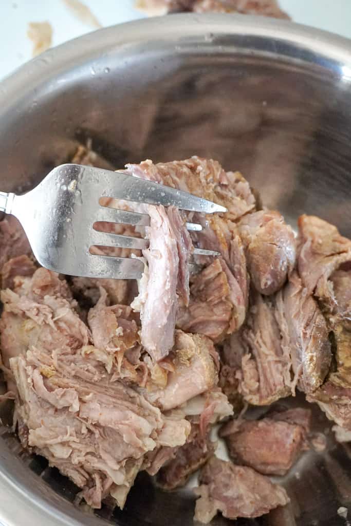 using a fork to shred pork butt