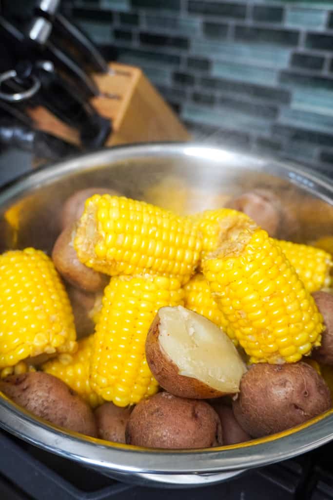 bowl containing cooked corn and potatoes