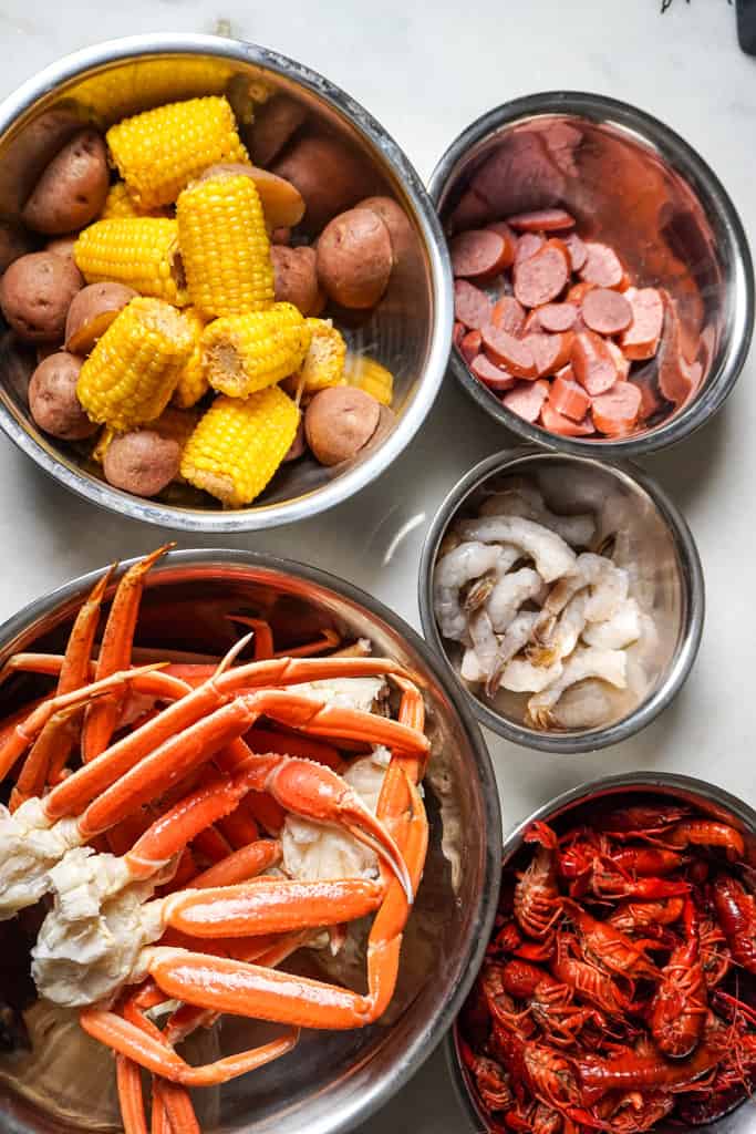 seafood boil bag ingredients in bowls