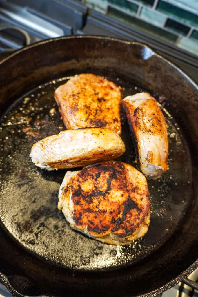 seared boneless pork chops in the skillet