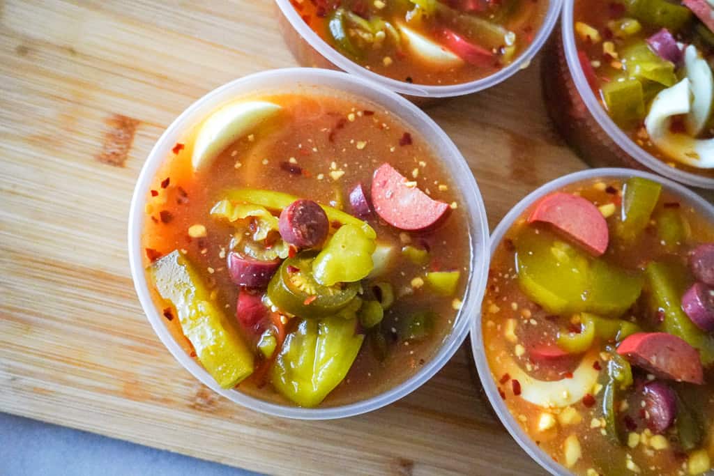 individual spicy bowls on a cutting board