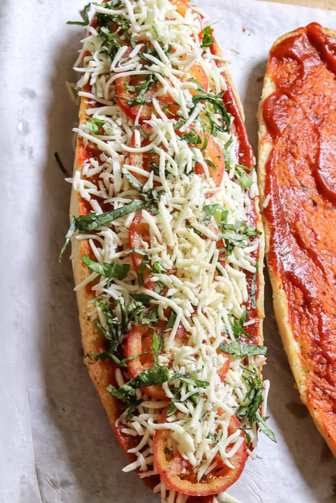 unbaked assembled Margherita Pizza on french bread