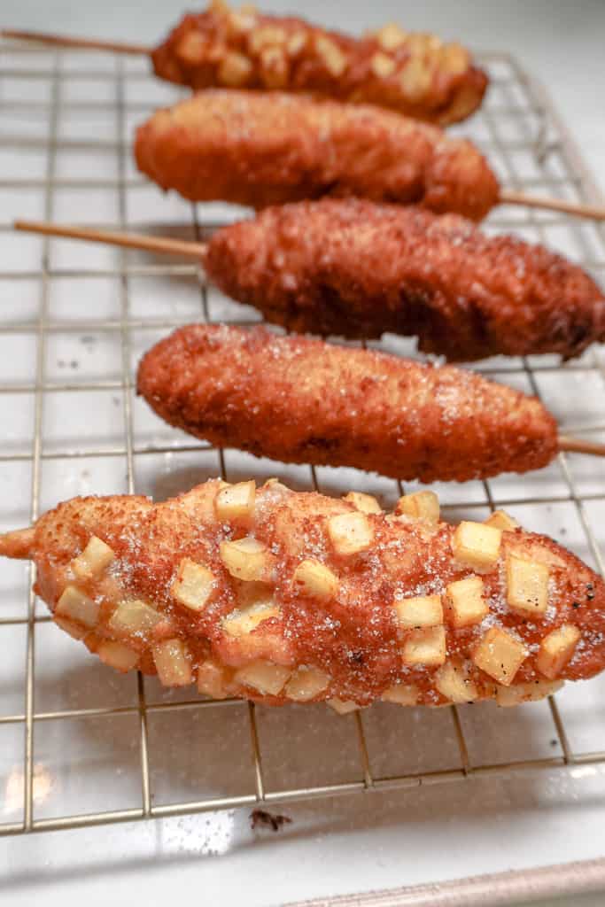 korean corn dogs on a cooling tray