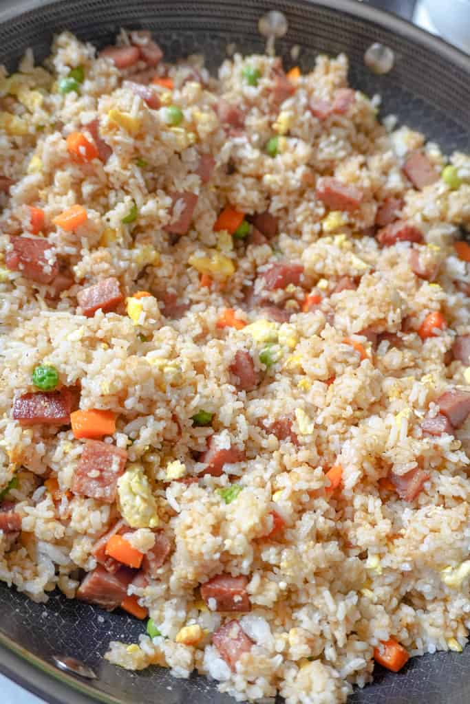 close up view of spam fried rice in a skillet