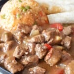 plated beef stew with tortillas and rice