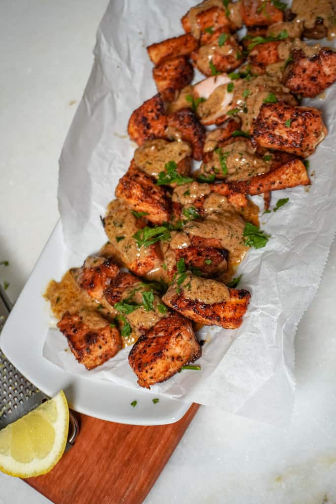 plated salmon bites with cajun garlic butter