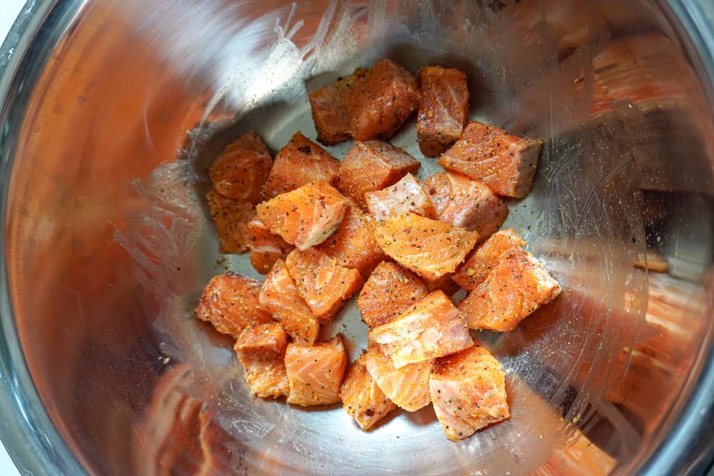 seasoned raw salmon bites in a bowl