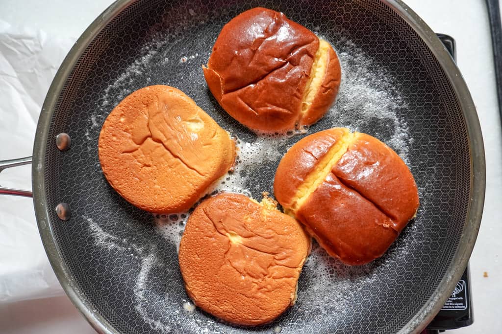 buns being toasted in a grill