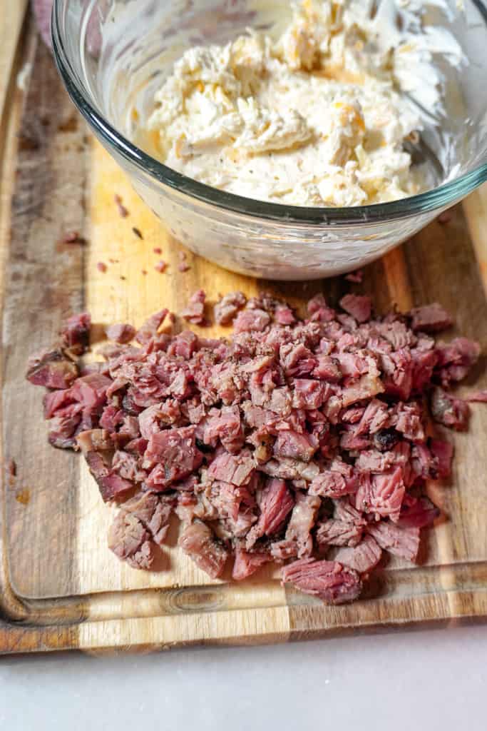 chopped brisket and a clear bowl full of a cheesy cream cheese mixture for texas twinkies