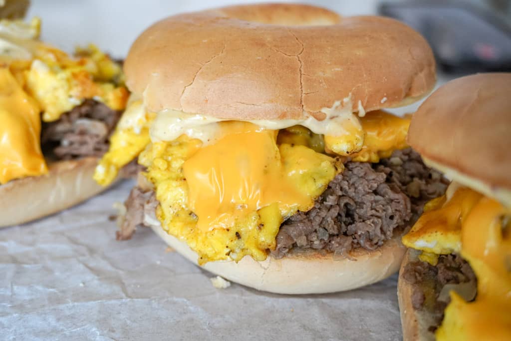 close up view of steak egg and cheese bagel sandwich