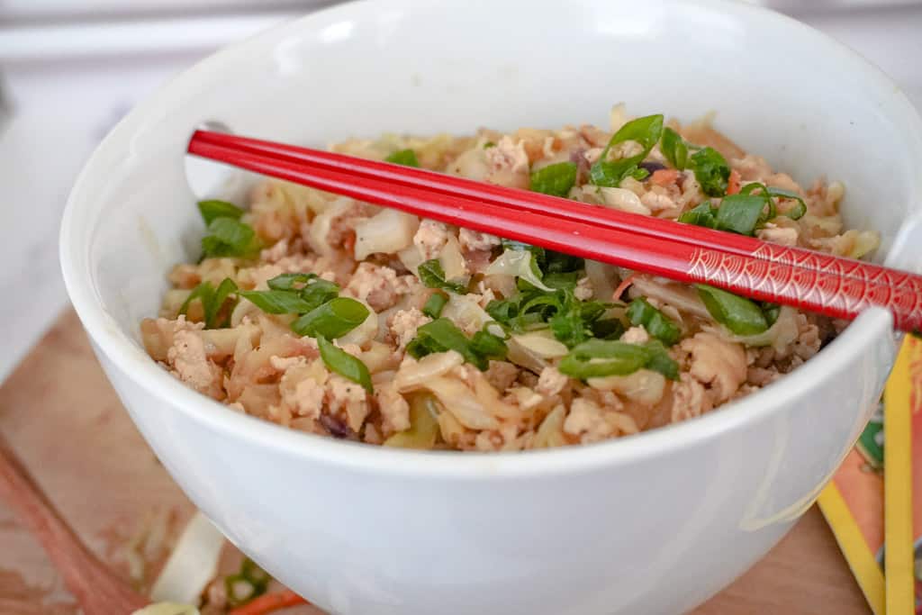 close up view of egg roll in a bowl