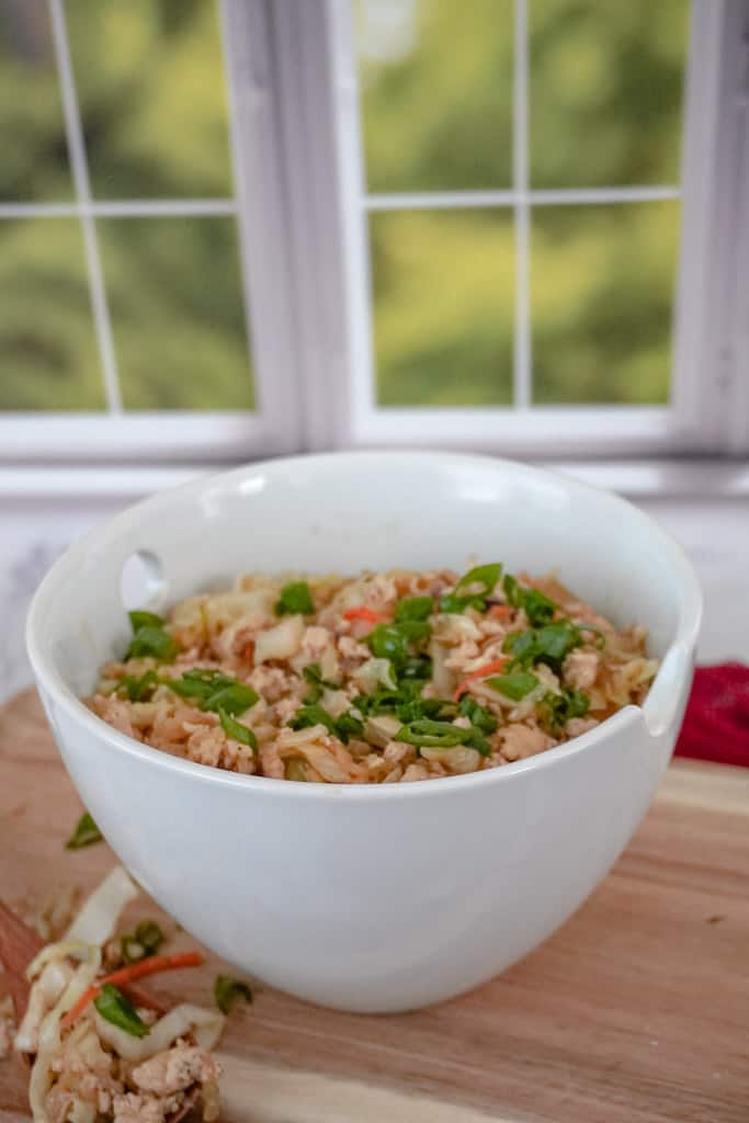 egg roll in a bowl on a cutting board