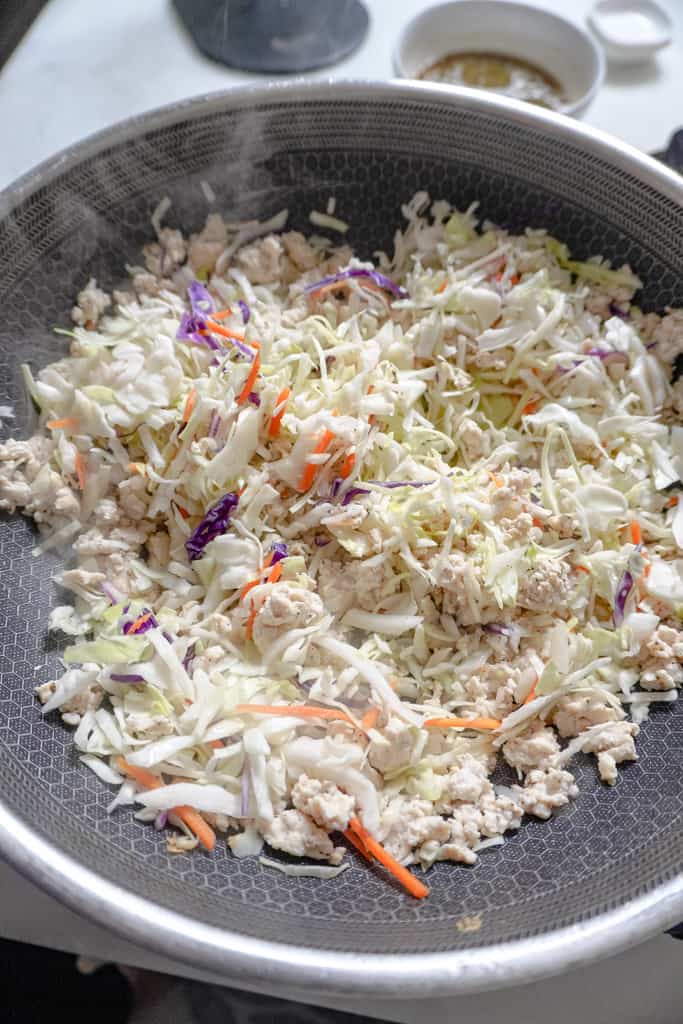 chopped cabbage cooking in a skillet