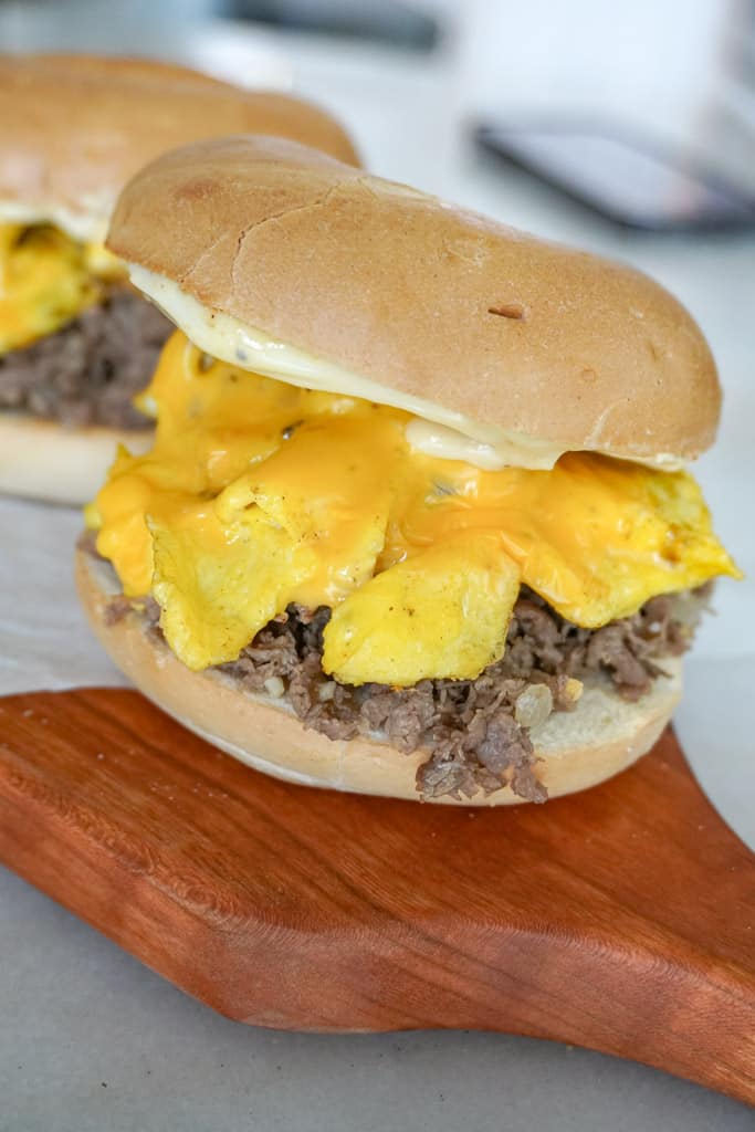 close up view of steak egg and cheese bagel sandwich