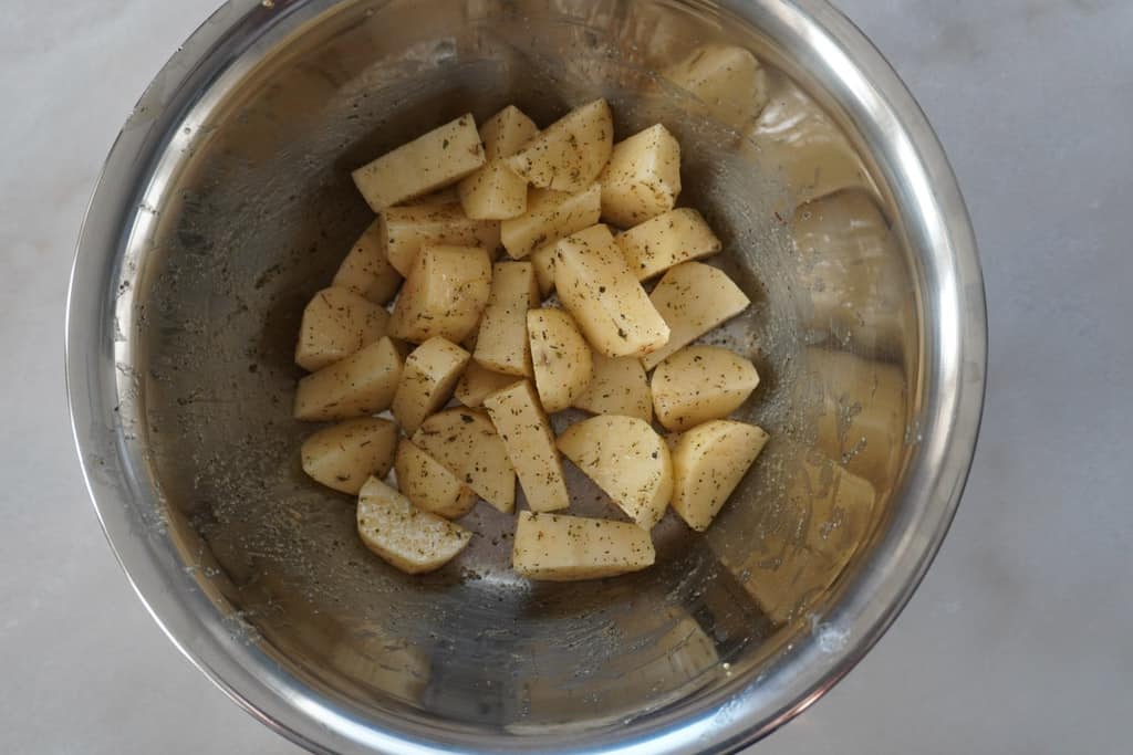 seasoned sliced potatoes in a bowl