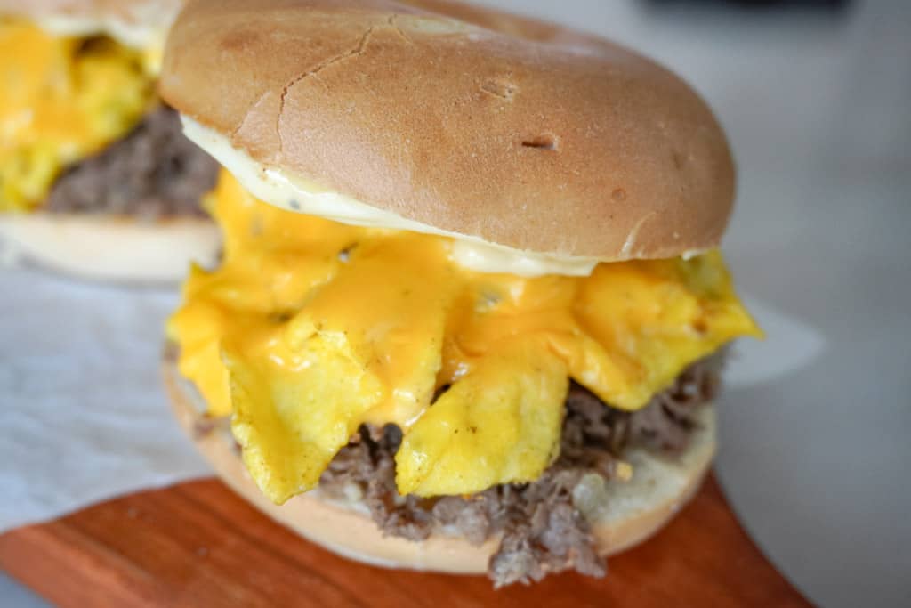 close up view of steak egg and cheese bagel sandwich
