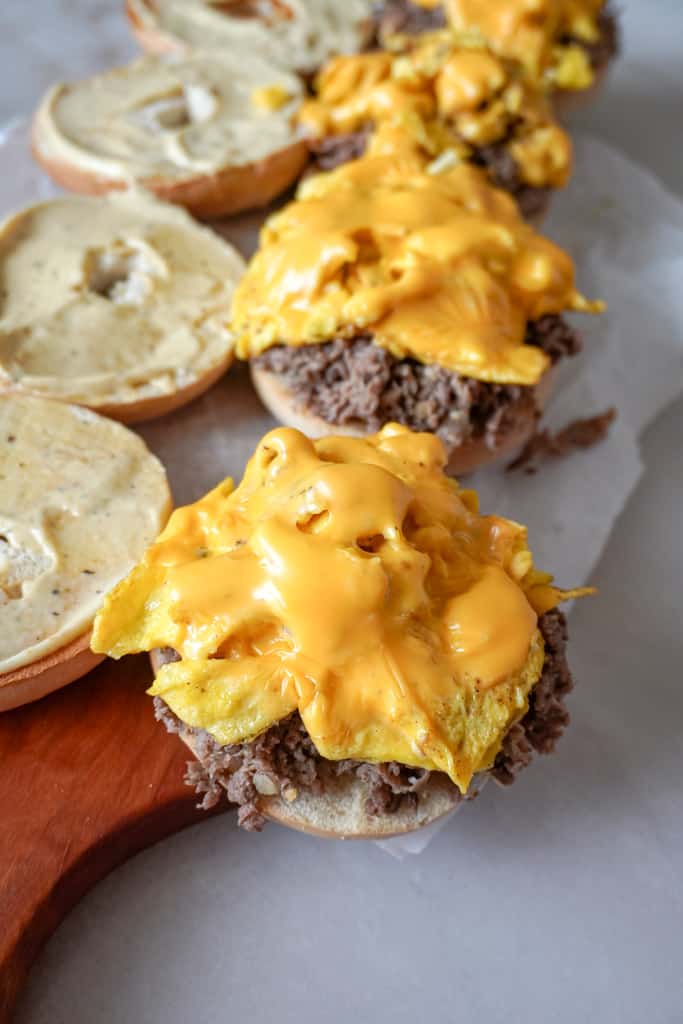 assembling steak egg and cheese bagels