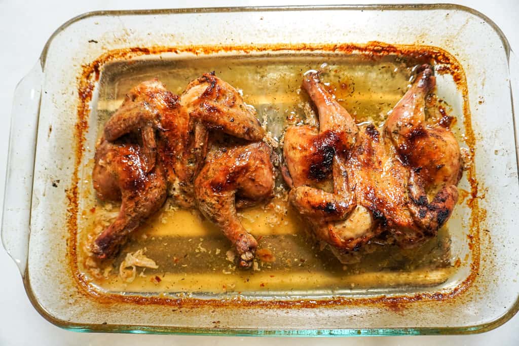 spatchocked chicken in baking pan