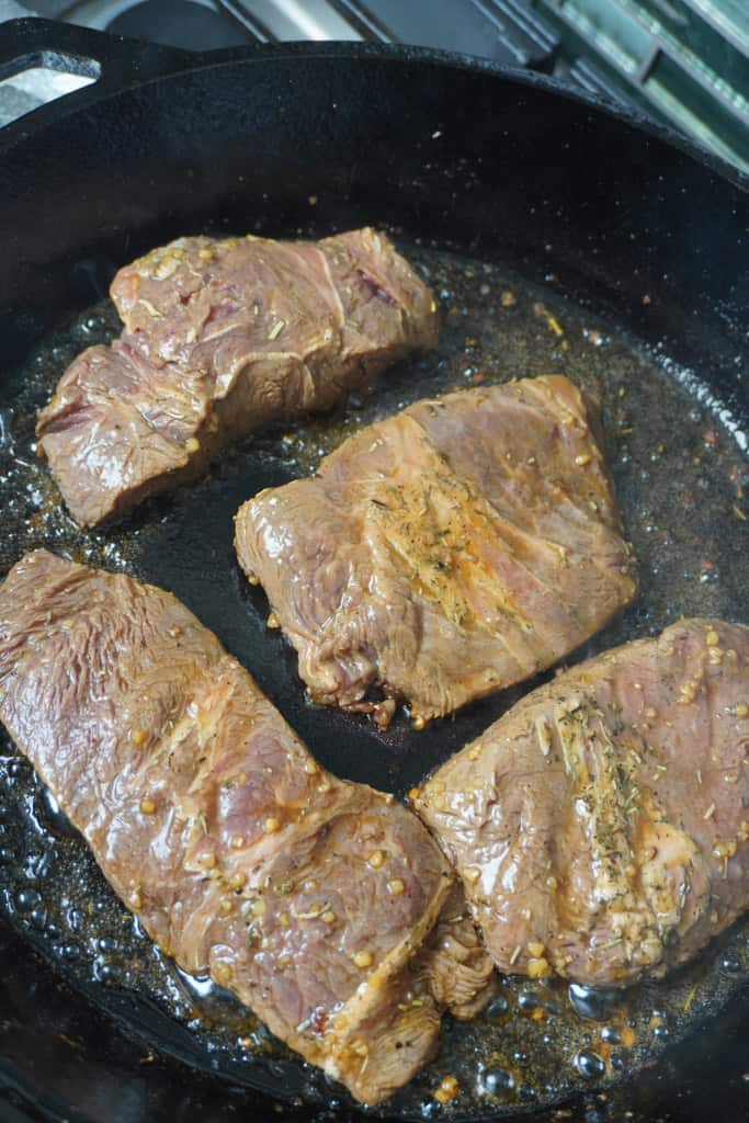 marinated flank steak on a pan