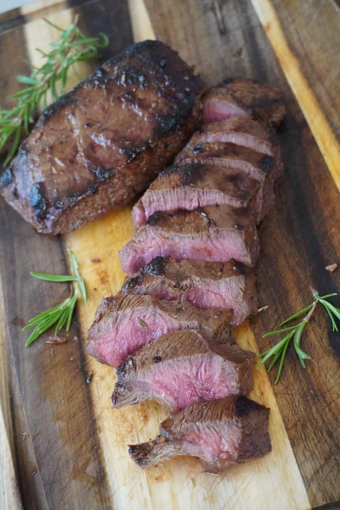 sliced steak on a cutting board