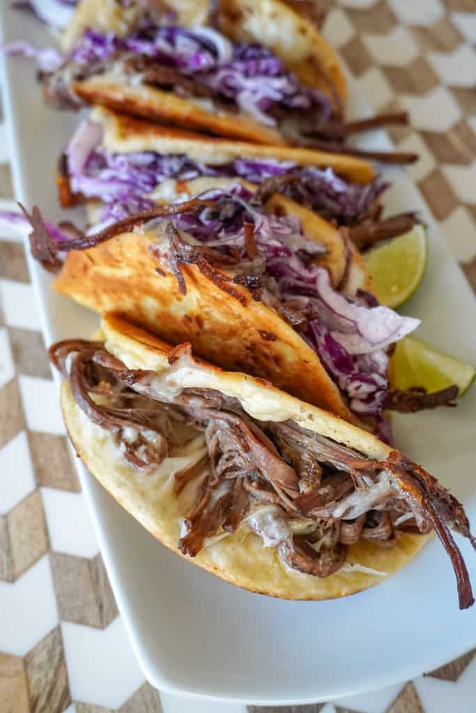 plated brisket tacos