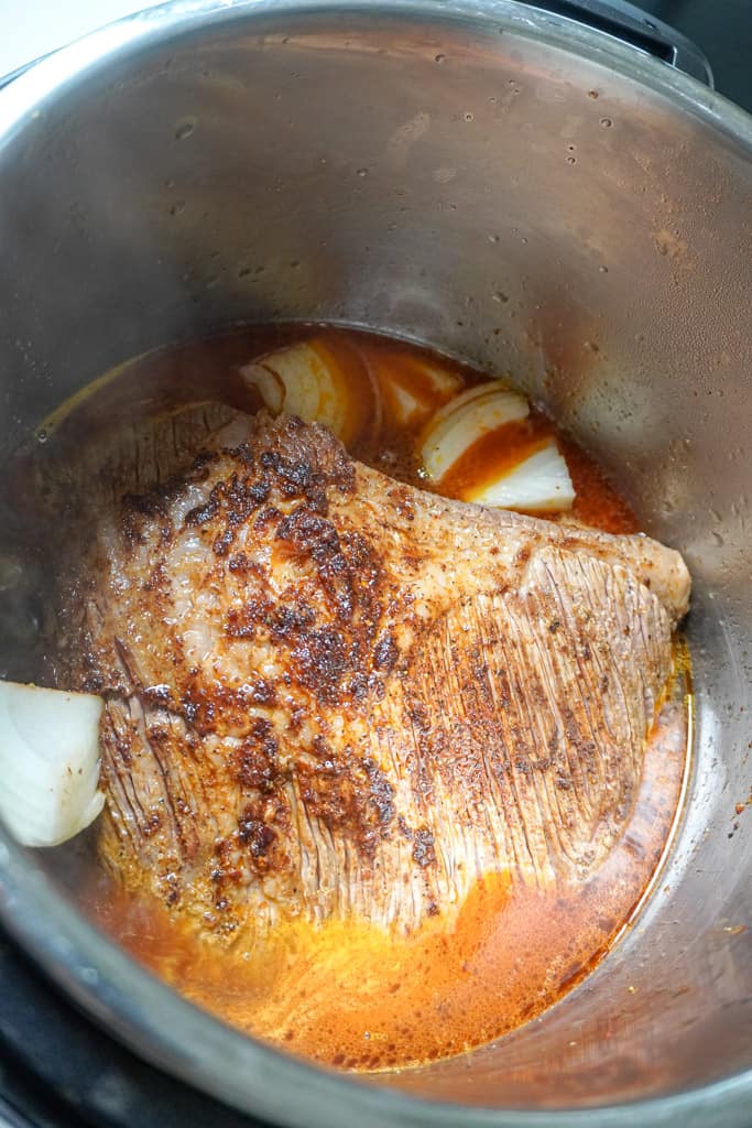 brisket in an instant with onions and broth