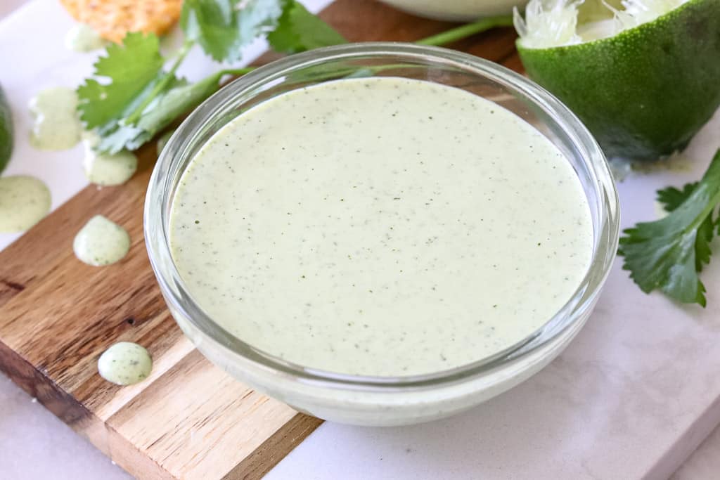 close up view of a saucer of jalapeno ranch