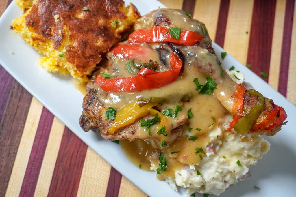 close up view of plated smothered chicken