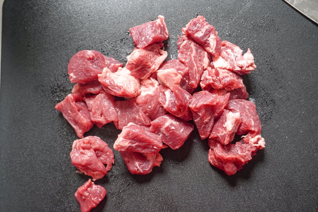 raw chopped steak on a cutting board