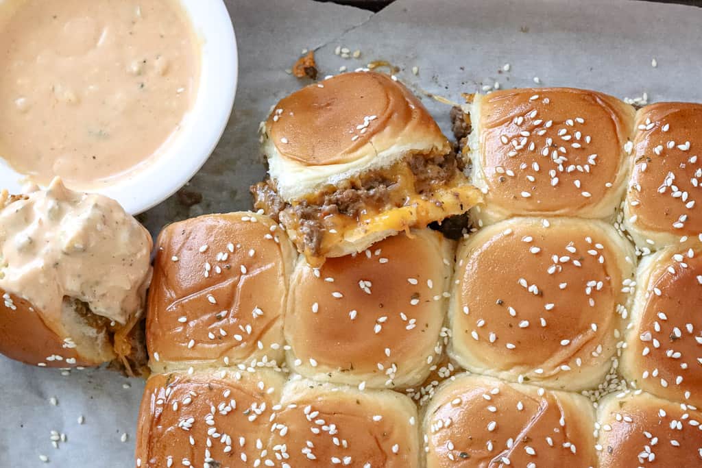 cheeseburger sliders with a side of dipping sauce