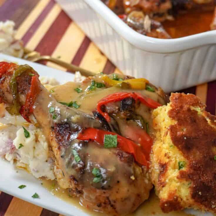 plated smothered chicken with cornbread