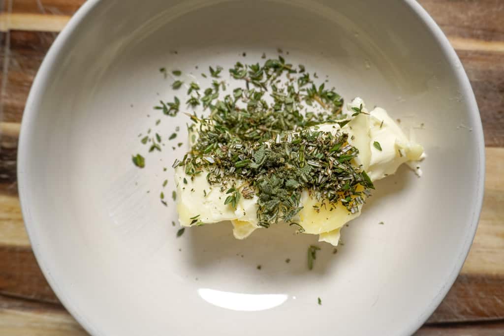 ingredients for herb butter in a bowl