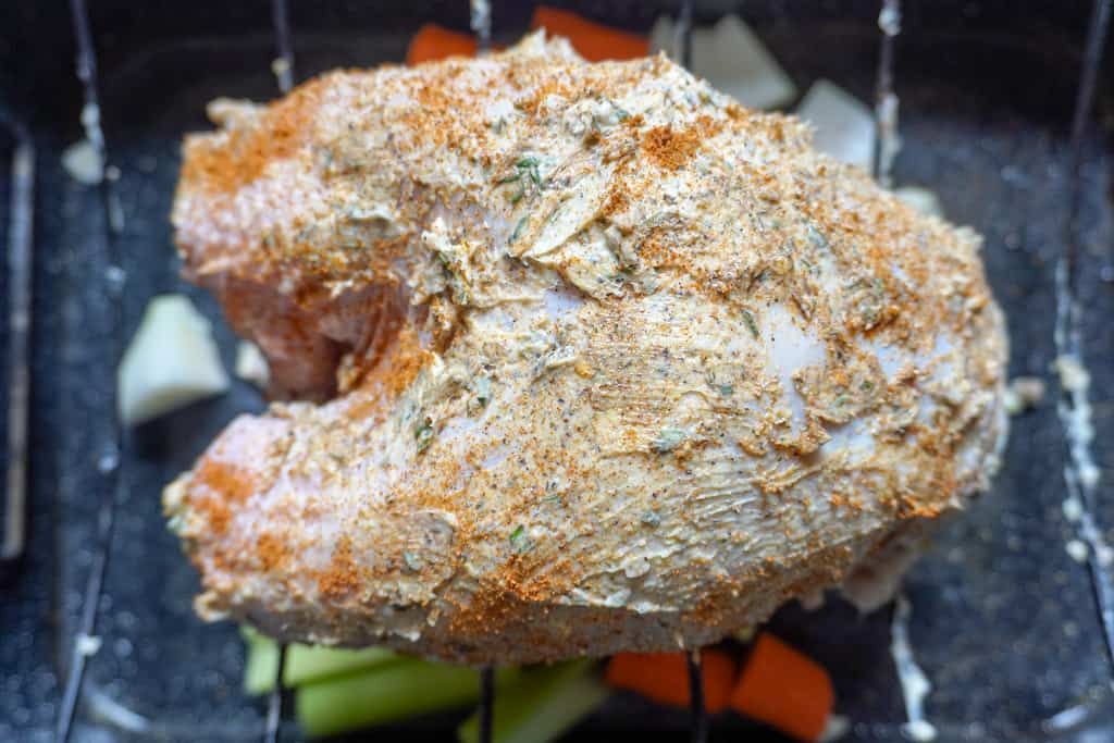 raw, seasoned turkey breast ready for the oven